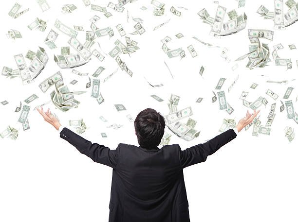 DFY digital products entrepreneurship success concept – man under raining money symbolizing passive income from online reselling with Earn Learning.